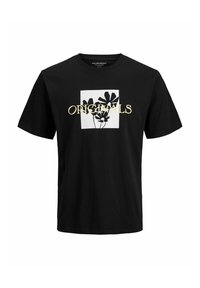 Camiseta de algodón negra con un corte relajado, que presenta un gráfico cuadrado blanco con siluetas de plantas y la palabra "ORIGINALS" en texto dorado.