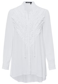 Weißes Langarmblusenshirt mit Rüschenverzierung an der Vorderseite, Knopfverschluss und leichtem High-Low-Saum. Hergestellt aus leichtem Stoff.
