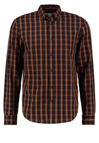 Chemise à carreaux présentant une palette de couleurs marron et bleu marine, avec un devant boutonné, des manches longues et un ourlet arrondi. Confectionnée en tissu tissé.