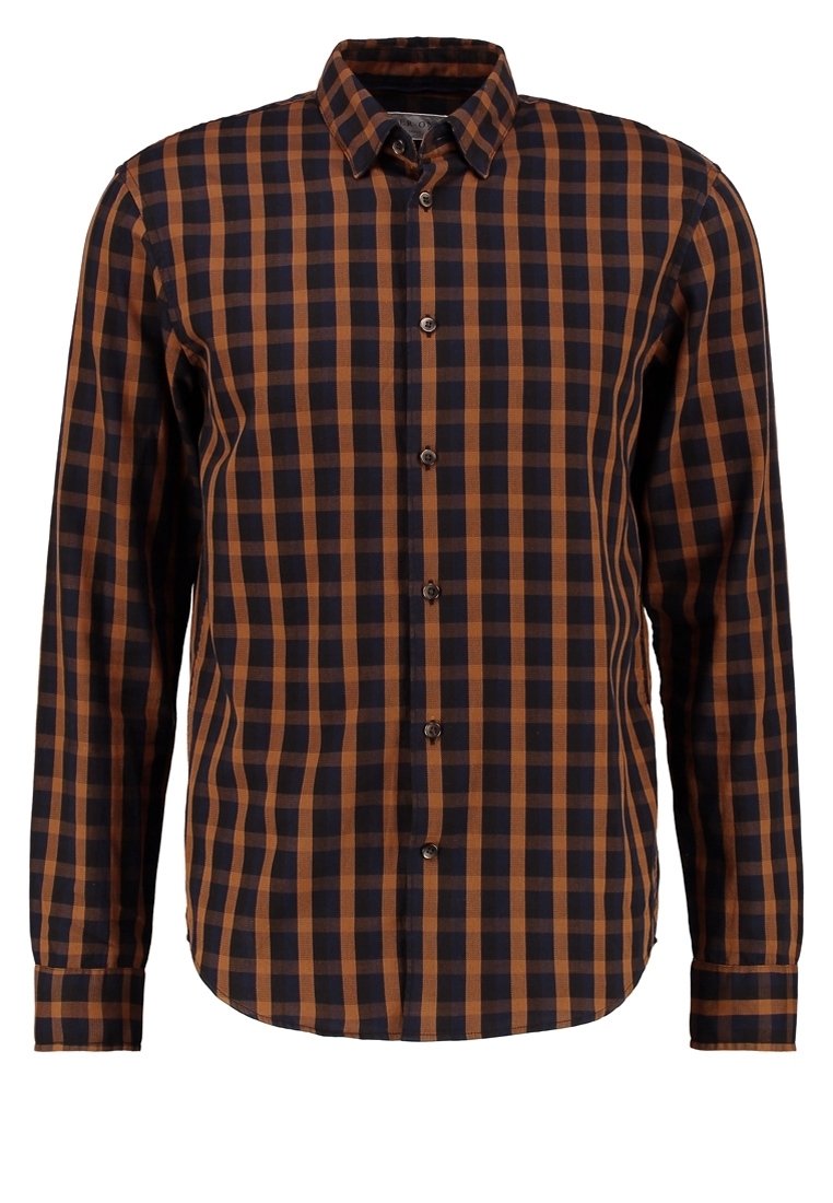 Chemise à carreaux présentant une palette de couleurs marron et bleu marine, avec un devant boutonné, des manches longues et un ourlet arrondi. Confectionnée en tissu tissé.