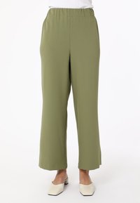 Olive green wide-leg pants made of lightweight fabric with an elastic waistband, featuring a smooth texture and clean, simple lines.