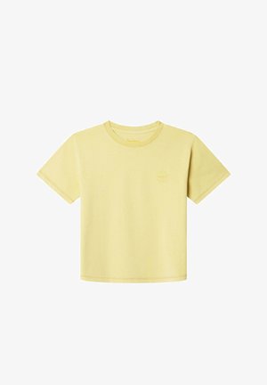 Krátky rukáv, bledohnedá bavlnená tričko s okrúhlym výstrihom a malým logom na ľavej hrudi. Mäkka textúra a pohodlný strih.