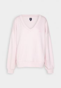 Sweat-shirt rose clair col en V, manches longues, poignets et ourlet côtelés, avec un logo GAP embossé discret sur la poitrine.