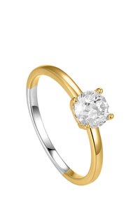 Gold and silver two-tone ring featuring a large, round, clear stone held by four prongs. Smooth, polished surface and slender band design.