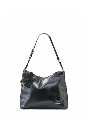 Black glossy shoulder bag with adjustable strap, decorative black flower on side, and small white "Desigual" logo on bottom right.