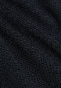 Black knitted fabric with a fine texture, displaying subtle variations in depth and a smooth, slightly stretchy surface.