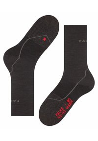 Calcetines de lana negros, con costuras gris claro y una "R" roja en el calcetín derecho. Tamaño impreso en la base: "42-43".