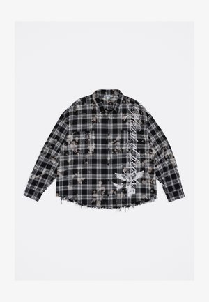 Black and white plaid shirt with frayed hem, bleach splatter pattern, button-down collar, and white graphic text and design on front.