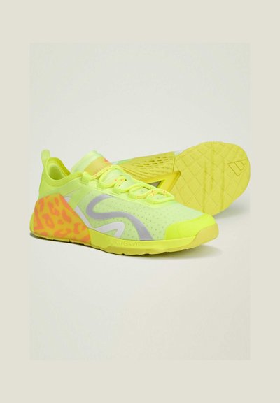 Neon yellow athletic shoes with grey accents, a textured mesh upper, and a pink leopard print design on the sides. Rubber sole with a patterned tread.