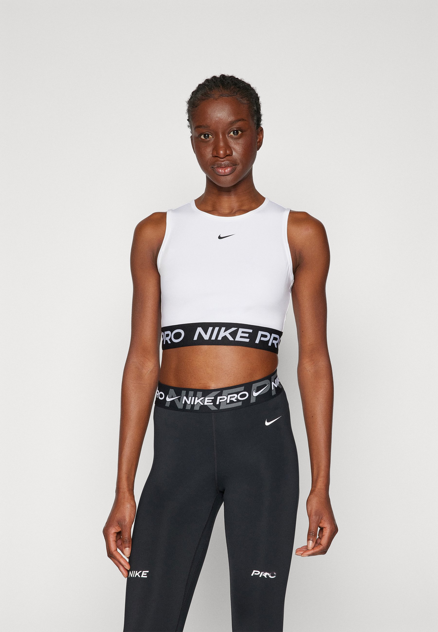 white and black nike crop top