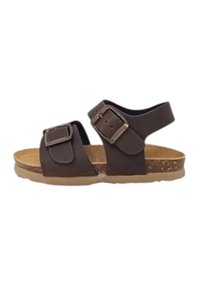 Sandali sintetici marroni con due fibbie regolabili, fondo in sughero e suola esterna testurizzata di color marrone chiaro. Design con cinturino alla caviglia per maggiore supporto.