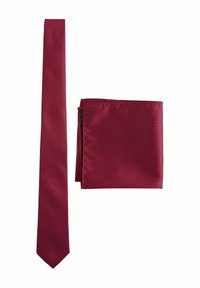 Burgundy tie with a textured pattern, narrow shape, and smooth satin finish, accompanied by a matching solid-colored pocket square.