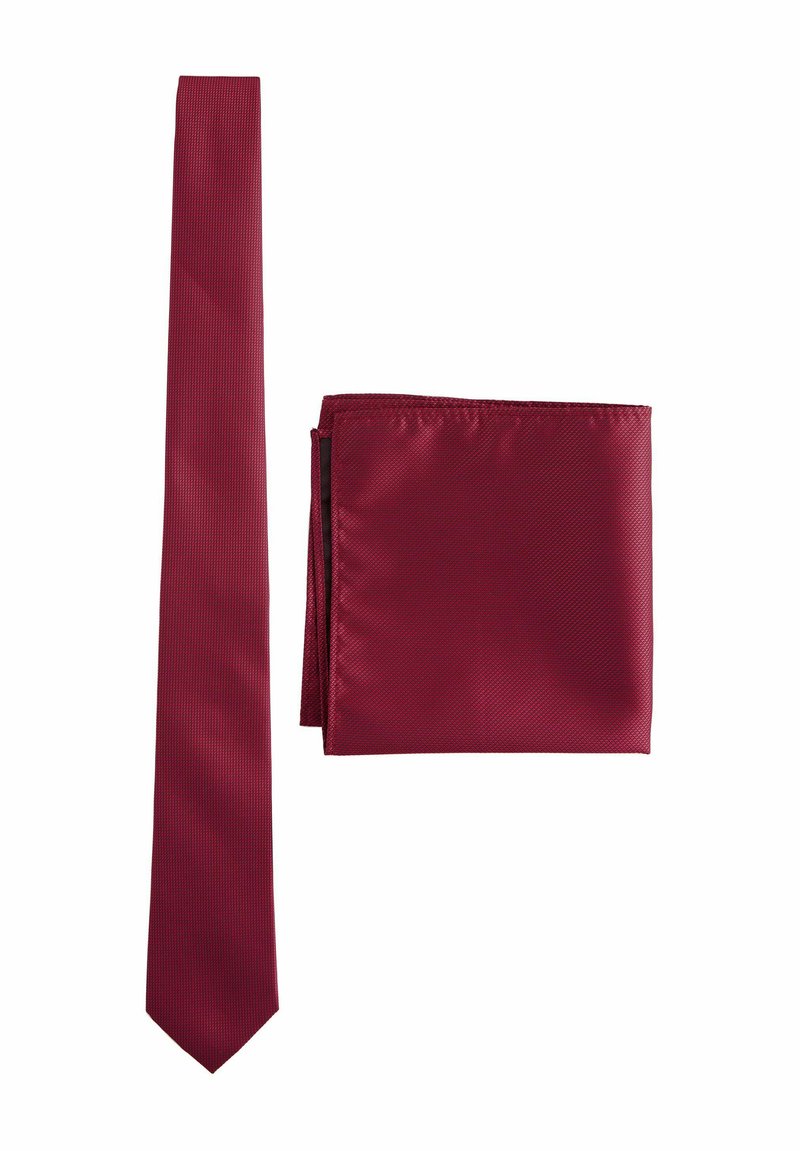 Burgundy tie with a textured pattern, narrow shape, and smooth satin finish, accompanied by a matching solid-colored pocket square.