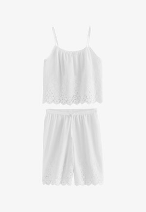Fehér, ujjatlan pamut felső és térdig érő rövidnadrág készlet, hímzett hullámos szegéllyel és állítható vállpántokkal.