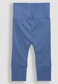 Blauwe katoenen leggings met een brede tailleband, taps toelopende benen en ribgebreide manchetten. Zachte textuur zonder zichtbare patronen of accenten.