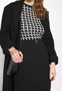 Morgan Tubino - black