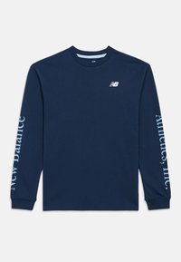 Navy blue long-sleeve shirt with New Balance logo on chest and "New Balance Athletics, Inc." text printed on sleeves.