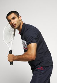 Sergio Tacchini CARSON - Calças de fato de treino - navy/red