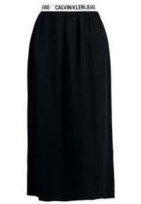 Gonna nera realizzata in tessuto morbido, caratterizzata da una vita elastica con il logo "CALVIN KLEIN JEANS". Design fluido, lunghezza alla caviglia.