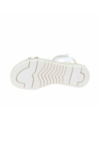 Witte sandaalzool met een textuur van rubber, voorzien van een zigzagpatroon en verhoogde accenten nabij de teen- en hielgebieden.