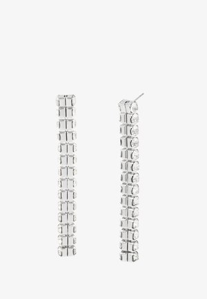 Boucles d'oreilles en métal argenté présentant des formes rectangulaires allongées avec des pierres claires taillées, créant un design linéaire et empilé.