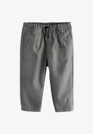 Black and white checkered pants with an elastic waistband, drawstring, and side pockets, offering a relaxed fit and breathable fabric.
