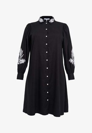 Schwarzes Kleid aus Baumwolle mit einem Kragen, vollem Ärmeln, dekorativer weißer Stickerei an den Manschetten und einer durchgehenden Knopfleiste.