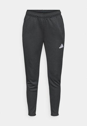 Schwarze Sporthose mit schmaler Passform, elastischem Bund und Seitentaschen. Auf dem linken Oberschenkel befindet sich ein kleines, weißes Adidas-Logo.