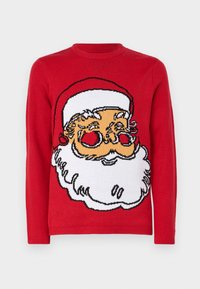 Pull en tricot rouge avec un grand design de visage de Santa, avec une barbe blanche et des accents rouges, col et poignets côtelés, texture douce.