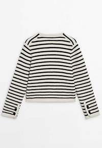 White textured long-sleeve sweater with horizontal black stripes and two black buttons on each cuff, shown from the back.