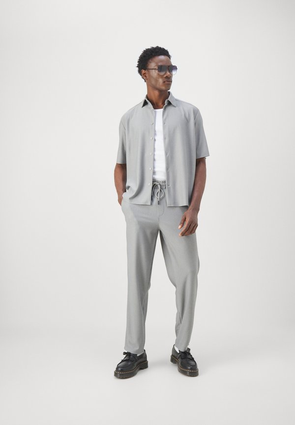 ONSSINUS  - Trousers - limestone2