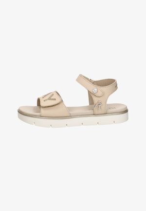 Sandale beige à bout ouvert avec brides réglables à la cheville et à l'avant, semelle blanche matelassée et petits embellissements décoratifs en strass.