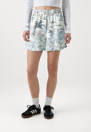 Colorful, patterned shorts featuring a tropical design with leaves, fruits, and palm trees. Elastic waistband, lightweight fabric, mid-thigh length.