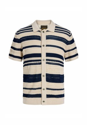 Polo en maille à manches courtes beige et bleu marine rayé, avec patte de boutonnage sur le devant et motif ajouré.