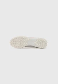 Footwear with a gray and white rubber sole, featuring prominent traction studs and a sleek design. Accents in pink add visual interest.