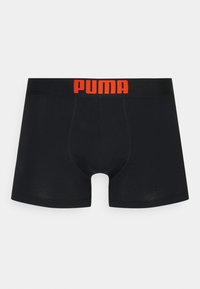 Black boxer briefs with elastic waistband featuring a red "PUMA" logo. Smooth fabric and fitted design for comfort and support.