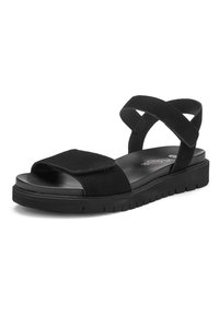 Sort sandal med åben tå, tyk sål, justerbare stropper foran og om anklen samt tekstureret bund for bedre greb.