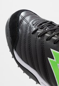 Lotto STADIO 300 II TF - Voetbalschoenen voor kunstgras - all black/spring green