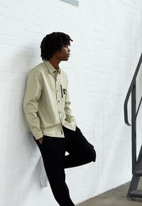 Calvin Klein Jeans TWO TONE MONOGRAM PANT - Pantaloni sportivi - black