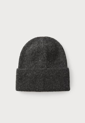Gray knitted beanie made of wool, featuring a ribbed texture and folded cuff. Round top for a snug fit.