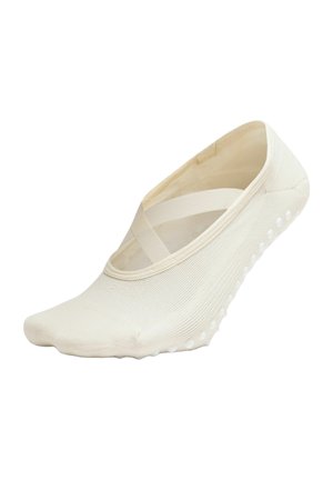 Crèmekleurige split-toe balletkous met elastische kruisbandjes en siliconen gripdoppen op de zool voor antislip binnenshuis gebruik.