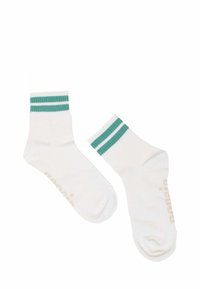 White ankle socks featuring two teal horizontal stripes at the top and subtle branding in a light color on the side. Soft knit fabric.
