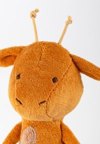 Soft, orange plush toy with a rounded head, small ears, and two fabric antennae. Features embroidered eyes and a stitched mouth.