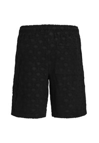 Black shorts with a textured pattern resembling overlapping arcs. Features an elastic waistband and a single back pocket.