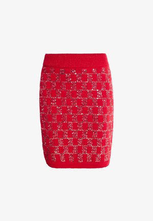 Jupe tricotée rouge avec un motif en damier orné de sequins, une taille côtelée et une silhouette ajustée.