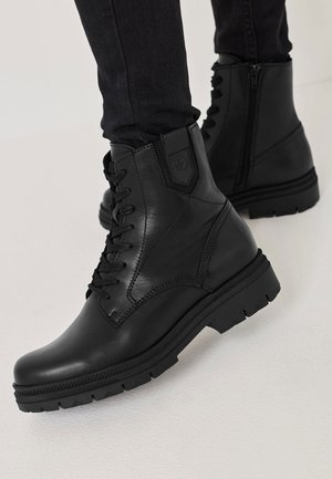 Tamaris Enkellaarsjes met plateauzool - black leather