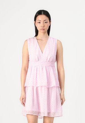 Pink dress made of sheer fabric with a layered design. Features a v-neckline, short sleeves, and textured polka dot pattern.