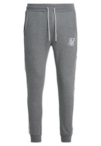 Szare spodnie dresowe z bawełnianej mieszanki, z regulowanym paskiem w talii, ściągaczami przy nogawkach i boczną taśmą z logo. Gładka faktura.