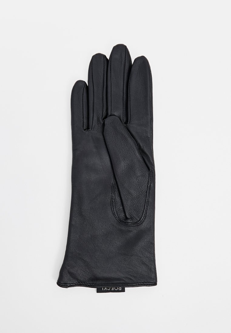 Schwarzer Lederhandschuh mit glatter Textur, Fünf-Finger-Design und dezenten Nähdetails. Etikett an der Handgelenkstelle angebracht.