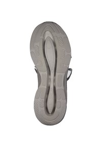 Sola di sneaker grigia con motivi testurizzati, progettata per la trazione, con una suola intermedia a forma di onda e accenti circolari.